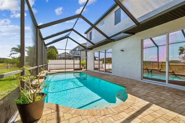 pool with a patio and a lanai