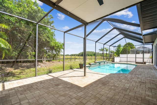 pool featuring a patio area, a lanai, and a hot tub