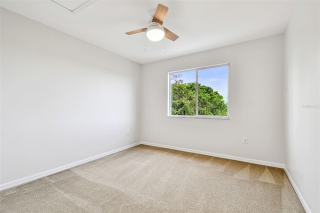 unfurnished room featuring ceiling fan, baseboards, and carpet