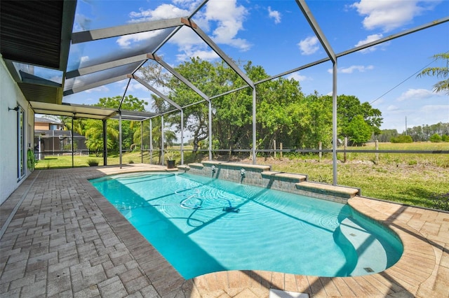 pool with a patio and glass enclosure