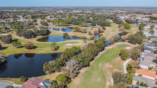 birds eye view of property with a water view and golf course view