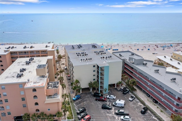 aerial view with a water view and a view of the beach