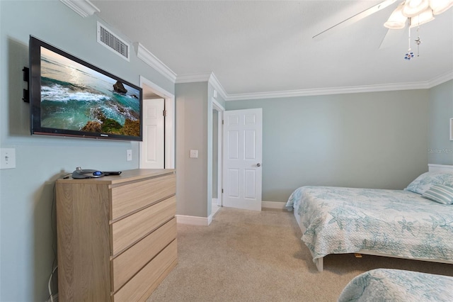 bedroom with visible vents, baseboards, ornamental molding, a ceiling fan, and light colored carpet