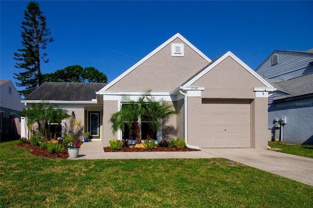 12140 74th St, Largo, FL 33773 - ranch-style house with a front lawn, driveway, stucco siding, and an attached garage
