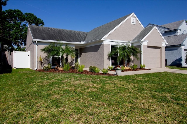12140 74th St, Largo, FL 33773 - view of front of home featuring stucco siding, a garage, a front lawn, and concrete driveway