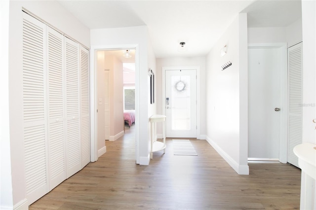 12140 74th St, Largo, FL 33773 - foyer featuring baseboards and wood finished floors