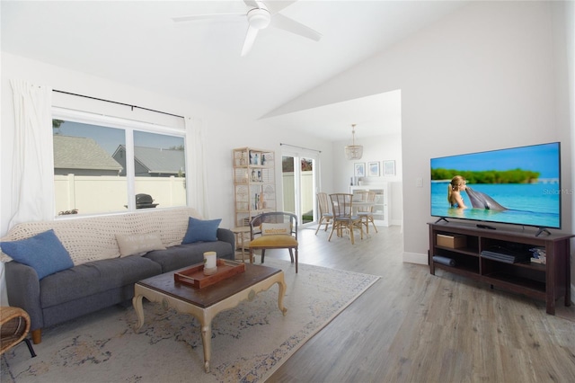 12140 74th St, Largo, FL 33773 - living room featuring baseboards, lofted ceiling, wood finished floors, and a ceiling fan