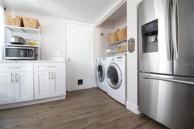 12140 74th St, Largo, FL 33773 - laundry room with wood finished floors, laundry area, and washer and clothes dryer