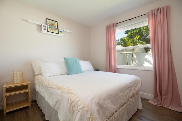 12140 74th St, Largo, FL 33773 - bedroom featuring baseboards and wood finished floors