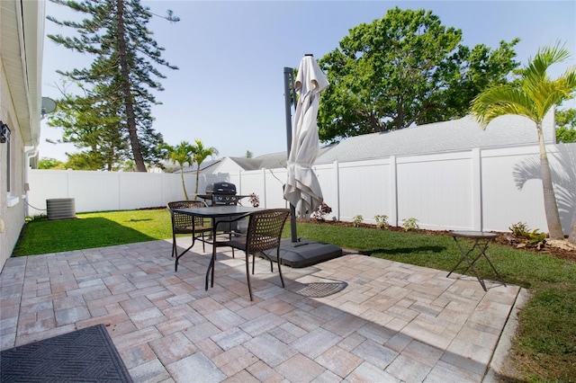 12140 74th St, Largo, FL 33773 - view of patio / terrace with central air condition unit and a fenced backyard