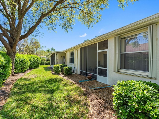 view of yard featuring a sunroom