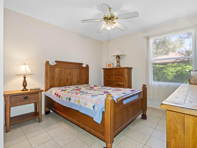bedroom with light tile patterned floors and a ceiling fan