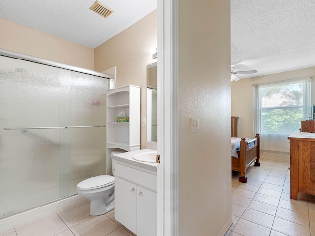 bathroom with tile patterned floors, visible vents, ceiling fan, and vanity