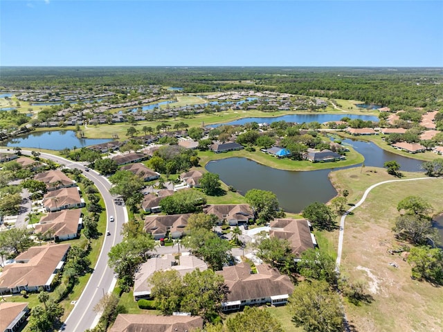 bird's eye view with a residential view and a water view