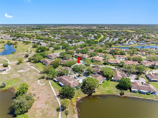 birds eye view of property featuring a residential view and a water view