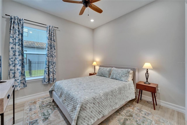 bedroom with recessed lighting, baseboards, wood finished floors, and a ceiling fan