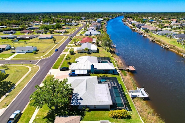 birds eye view of property featuring a residential view and a water view