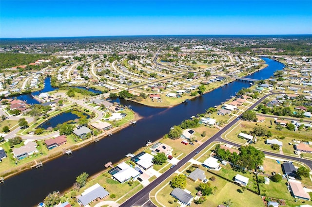 aerial view with a water view and a residential view
