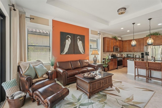 living room featuring a toaster, crown molding, recessed lighting, and a raised ceiling