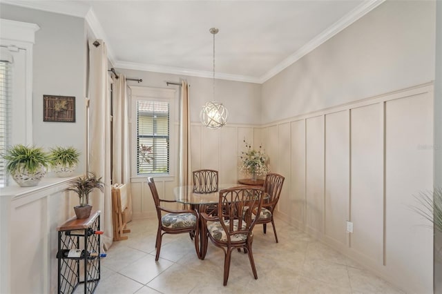 dining area featuring ornamental molding, a decorative wall, and light tile patterned floors