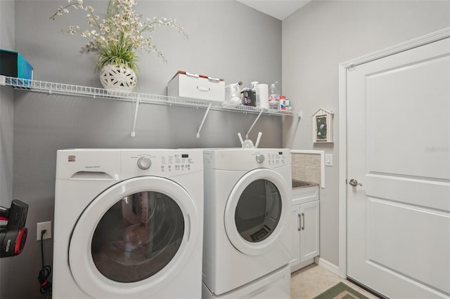 laundry area with cabinet space and washing machine and dryer
