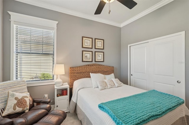 bedroom featuring a closet, ornamental molding, and ceiling fan