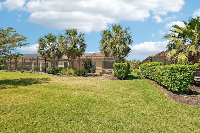 view of yard with a lanai