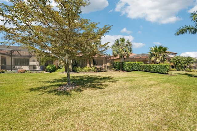 view of yard with a lanai