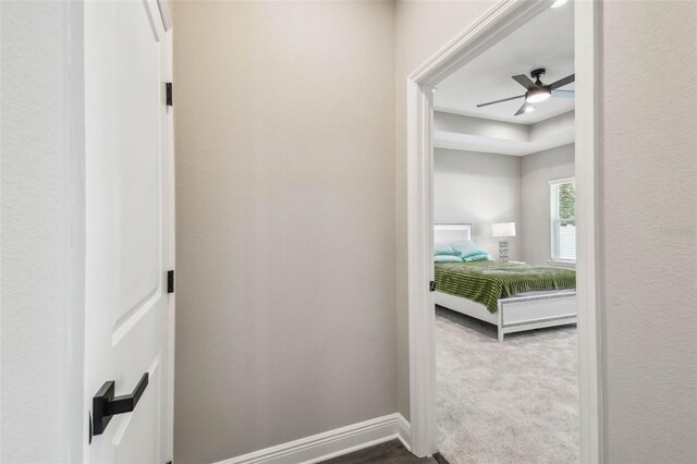 4307 Dristol Ave, Spring Hill, FL 34609 - hallway with baseboards and dark colored carpet