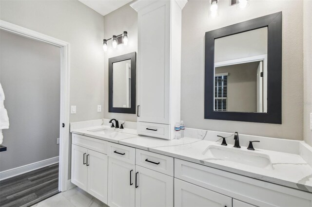 4307 Dristol Ave, Spring Hill, FL 34609 - full bathroom featuring double vanity, a sink, and baseboards