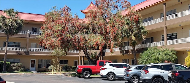 2402 Ecuadorian Way Unit 20, Clearwater, FL 33763 - view of building exterior featuring uncovered parking