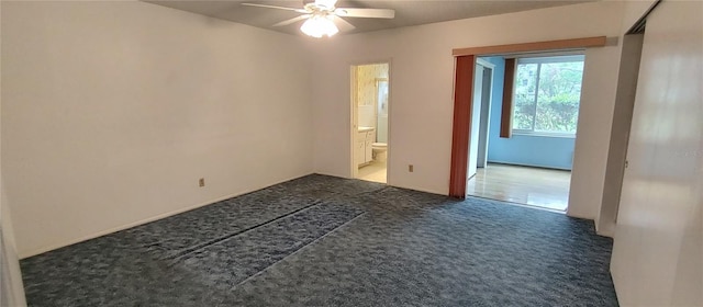 2402 Ecuadorian Way Unit 20, Clearwater, FL 33763 - spare room with a ceiling fan and carpet