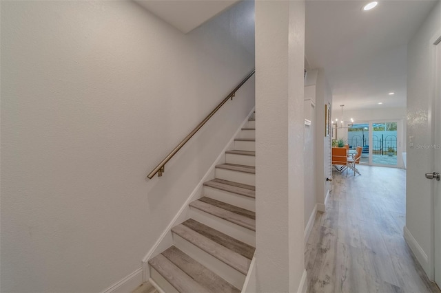 2700 Bayshore Blvd Unit 588, Dunedin, FL 34698 - stairway with wood finished floors, recessed lighting, and a chandelier