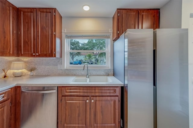 2700 Bayshore Blvd Unit 588, Dunedin, FL 34698 - kitchen featuring appliances with stainless steel finishes, tasteful backsplash, light countertops, and brown cabinets