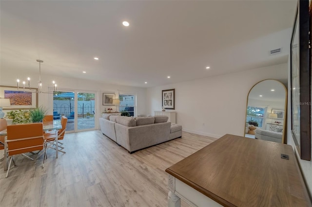 2700 Bayshore Blvd Unit 588, Dunedin, FL 34698 - living room featuring a chandelier, healthy amount of natural light, recessed lighting, and light wood-type flooring