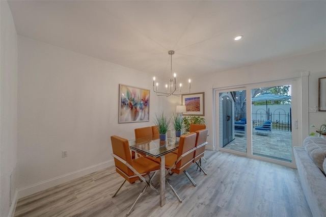 2700 Bayshore Blvd Unit 588, Dunedin, FL 34698 - dining room featuring a chandelier and light wood finished floors