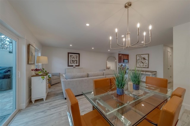 2700 Bayshore Blvd Unit 588, Dunedin, FL 34698 - dining area featuring a chandelier, light wood-style flooring, and recessed lighting