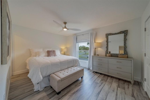 2700 Bayshore Blvd Unit 588, Dunedin, FL 34698 - bedroom with light wood-style floors, a ceiling fan, and access to outside