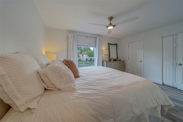 2700 Bayshore Blvd Unit 588, Dunedin, FL 34698 - bedroom featuring wood finished floors, a ceiling fan, and access to exterior