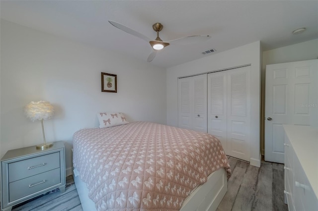2700 Bayshore Blvd Unit 588, Dunedin, FL 34698 - bedroom featuring wood finished floors, a closet, and ceiling fan