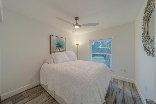 2700 Bayshore Blvd Unit 588, Dunedin, FL 34698 - bedroom with light wood-style flooring and a ceiling fan