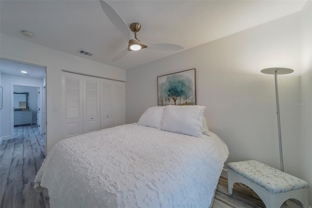 2700 Bayshore Blvd Unit 588, Dunedin, FL 34698 - bedroom with light wood-style floors, a closet, and ceiling fan