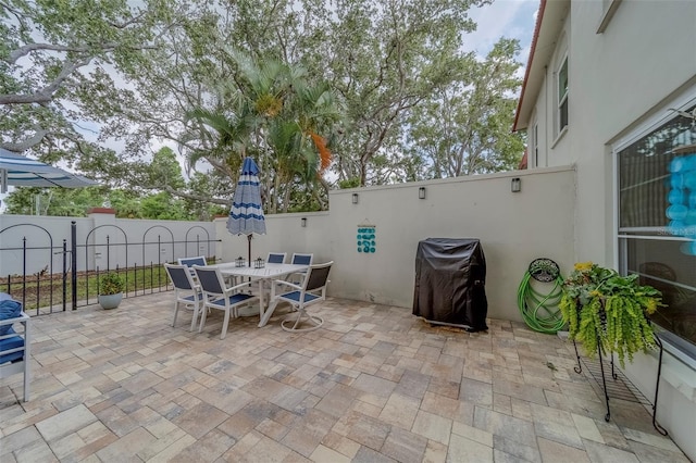 2700 Bayshore Blvd Unit 588, Dunedin, FL 34698 - view of patio / terrace with a grill and outdoor dining area
