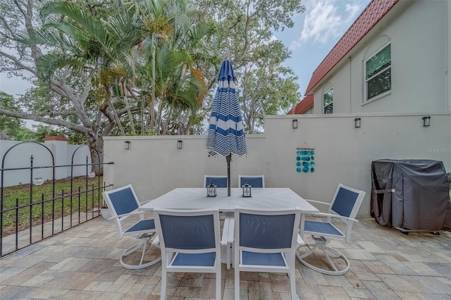 2700 Bayshore Blvd Unit 588, Dunedin, FL 34698 - view of patio with grilling area and outdoor dining space