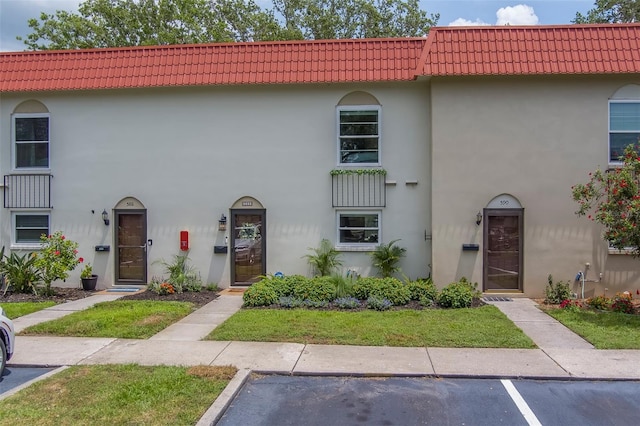 2700 Bayshore Blvd Unit 588, Dunedin, FL 34698 - multi unit property with a tile roof and stucco siding