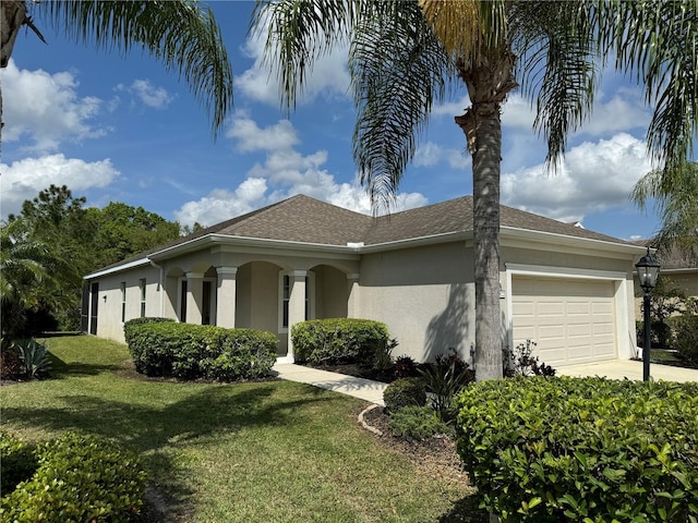 11822 Crawford Parrish Ln, Parrish, FL 34219 - view of property exterior featuring stucco siding, a garage, a yard, and concrete driveway