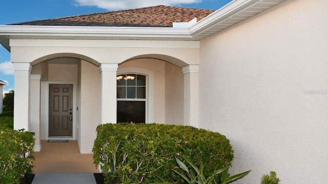 11822 Crawford Parrish Ln, Parrish, FL 34219 - property entrance featuring a shingled roof and stucco siding