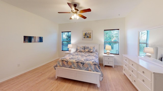 11822 Crawford Parrish Ln, Parrish, FL 34219 - bedroom with light wood-type flooring, ceiling fan, and baseboards