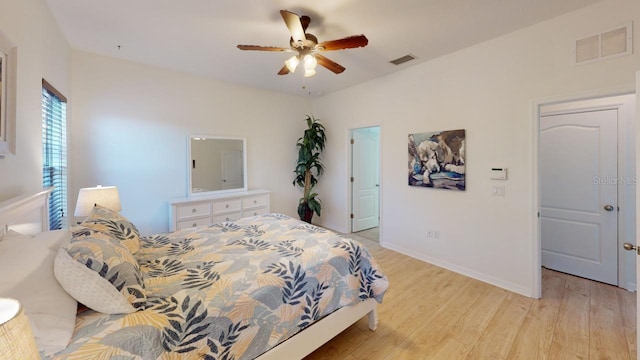 11822 Crawford Parrish Ln, Parrish, FL 34219 - bedroom with light wood-style flooring, ceiling fan, and baseboards