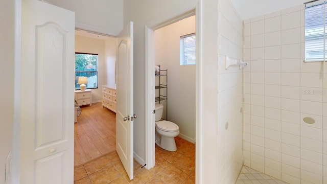 11822 Crawford Parrish Ln, Parrish, FL 34219 - bathroom featuring toilet, a tile shower, and tile patterned floors